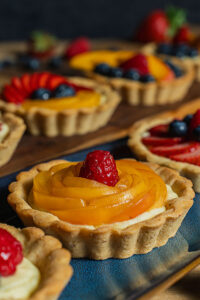 Fresh fruit tartlets made with Pate Sucree dough, filled with vanilla pastry cream