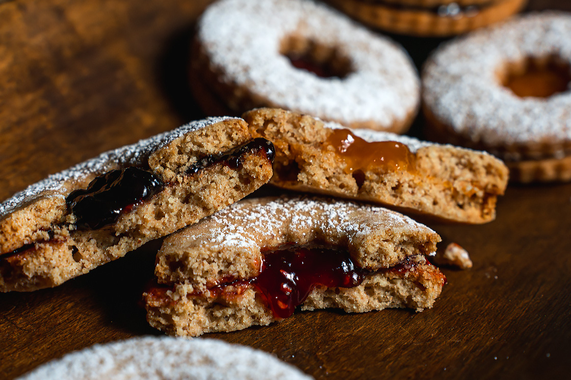 Jam-filled linzer holiday cookies made with organic spelt